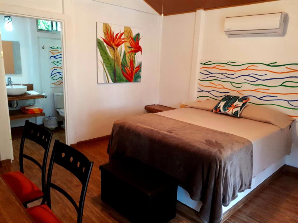 Postel nebo postele na pokoji v ubytování Tropical Paradise Bungalows