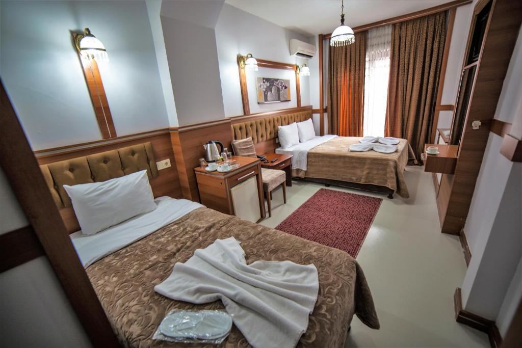 Postel nebo postele na pokoji v ubytování istanbul duhok hotel