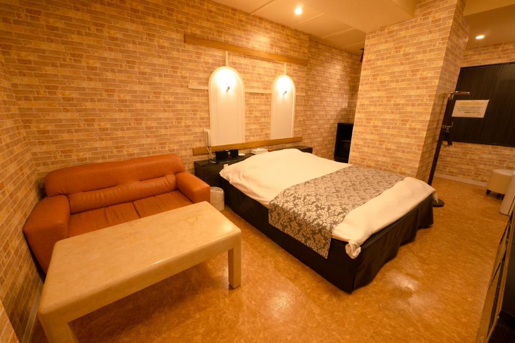 Postel nebo postele na pokoji v ubytování Hotel Allure (Adult Only)