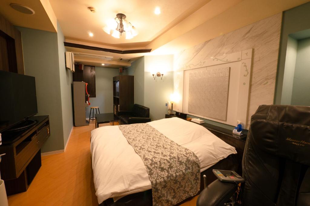 TV a/nebo společenská místnost v ubytování Hotel Allure (Adult Only)