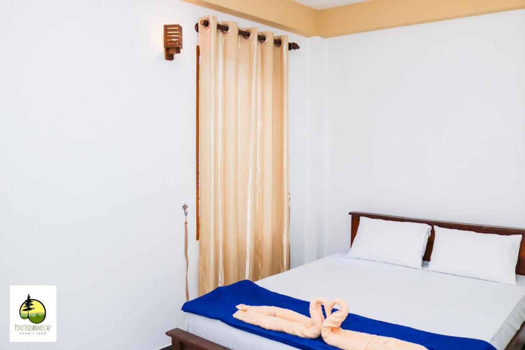 Postel nebo postele na pokoji v ubytování Pine Trees Homestay