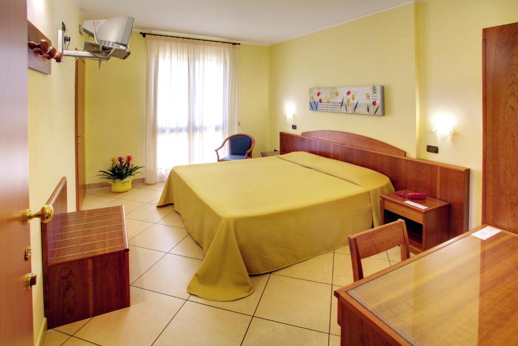 Postel nebo postele na pokoji v ubytování Lo Scacciapensieri Hotel & Restaurant