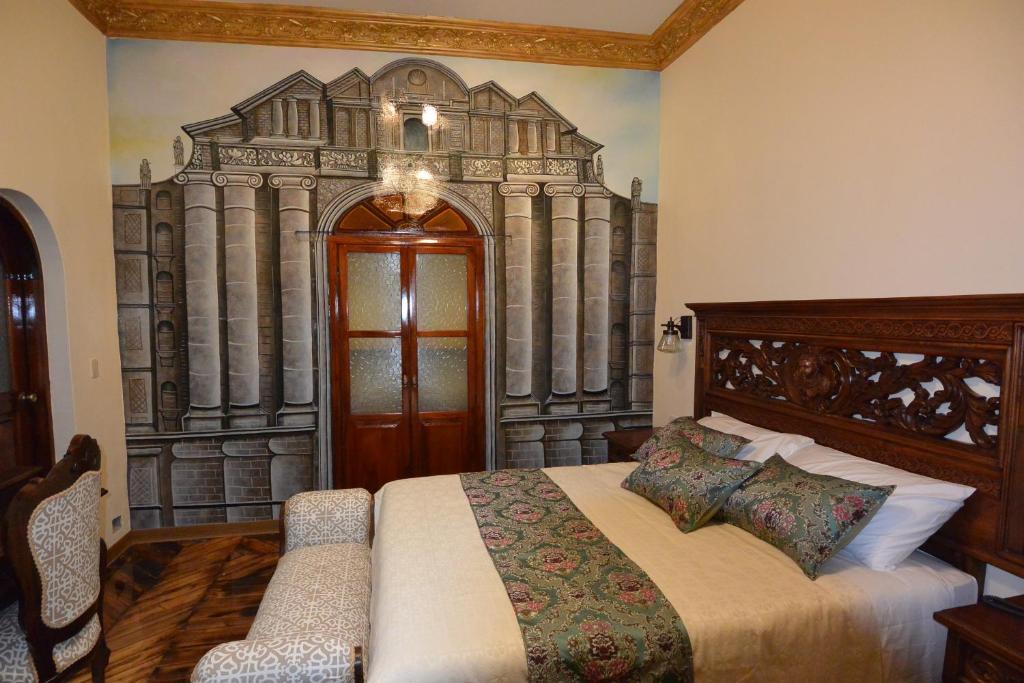 Postel nebo postele na pokoji v ubytování Hotel La Basílica Quito