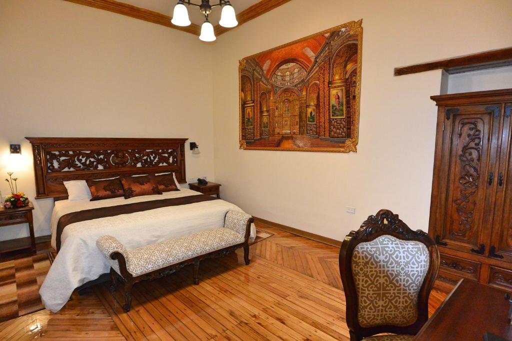 Postel nebo postele na pokoji v ubytování Hotel La Basílica Quito