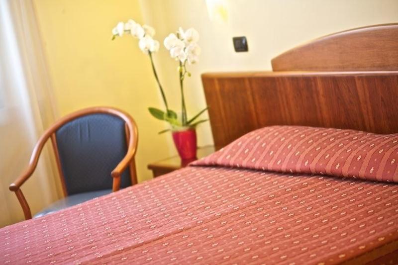 Postel nebo postele na pokoji v ubytování Lo Scacciapensieri Hotel & Restaurant