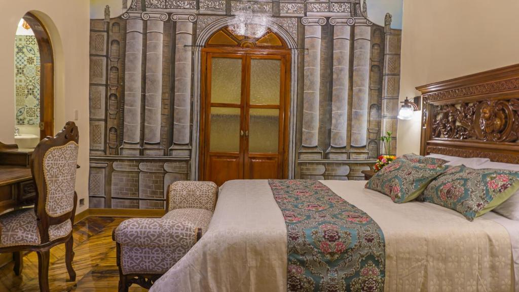 Postel nebo postele na pokoji v ubytování Hotel La Basílica Quito
