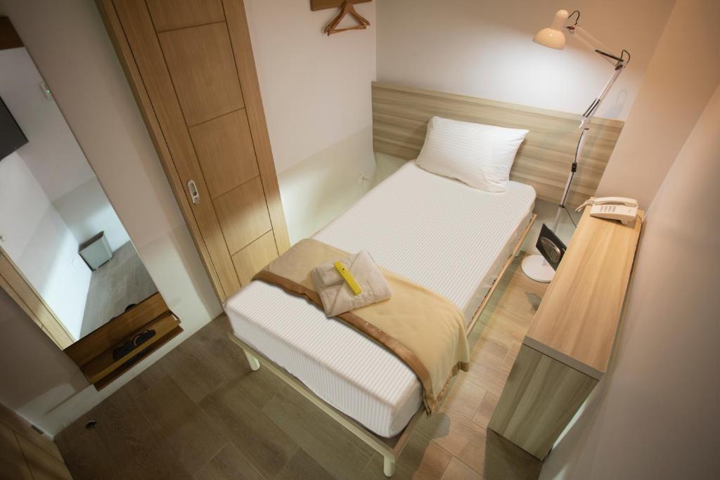 Postel nebo postele na pokoji v ubytování 1010 Hotel