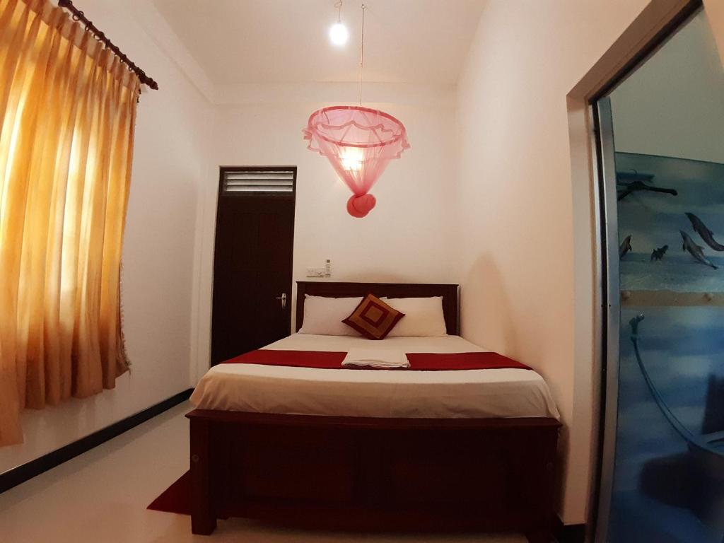 Postel nebo postele na pokoji v ubytování Radha Tourist Home