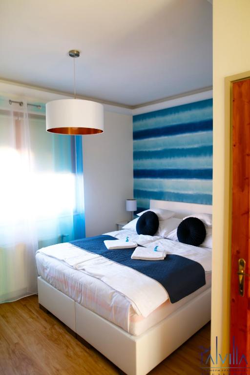 Postel nebo postele na pokoji v ubytování Pál Villa - Premium Apartments - Kecskemét