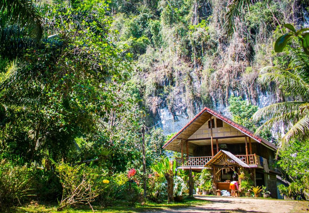 a house in the middle of a forest at Khao Sok Silver Cliff Resort in Khao Sok
