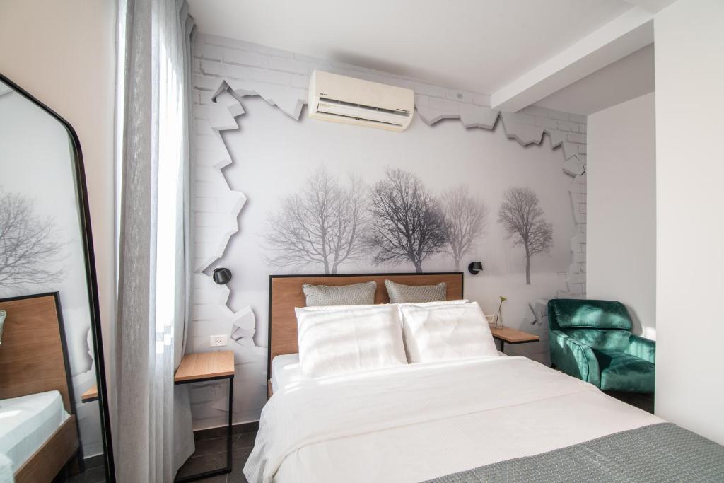 Postel nebo postele na pokoji v ubytování 27Montefiore - Urban ApartHotel TLV