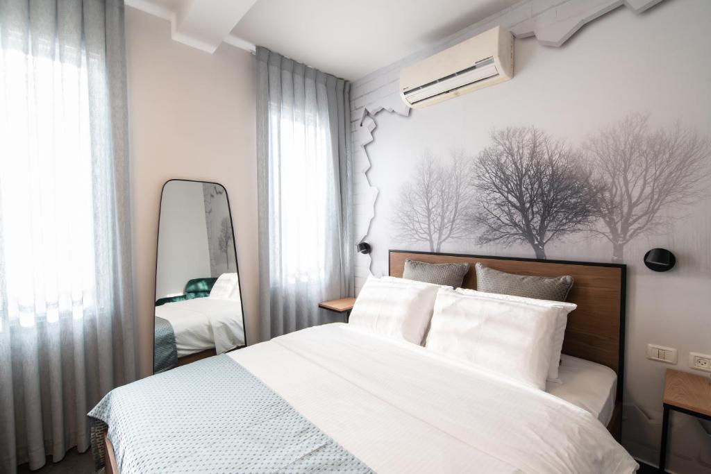 Postel nebo postele na pokoji v ubytování 27Montefiore - Urban ApartHotel TLV