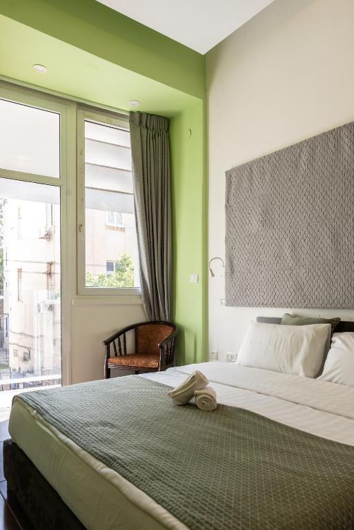 Postel nebo postele na pokoji v ubytování 27Montefiore - Urban ApartHotel TLV