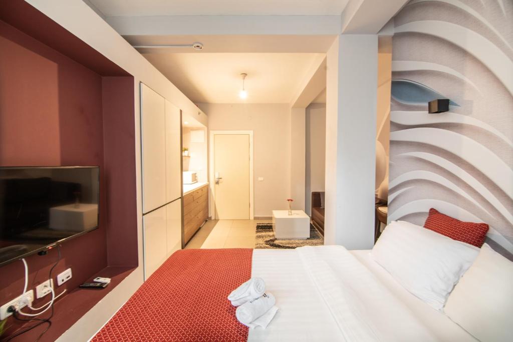 Postel nebo postele na pokoji v ubytování 27Montefiore - Urban ApartHotel TLV