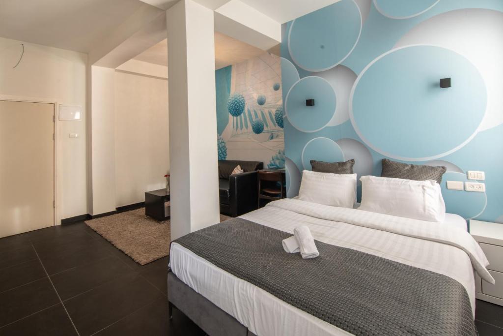 Postel nebo postele na pokoji v ubytování 27Montefiore - Urban ApartHotel TLV