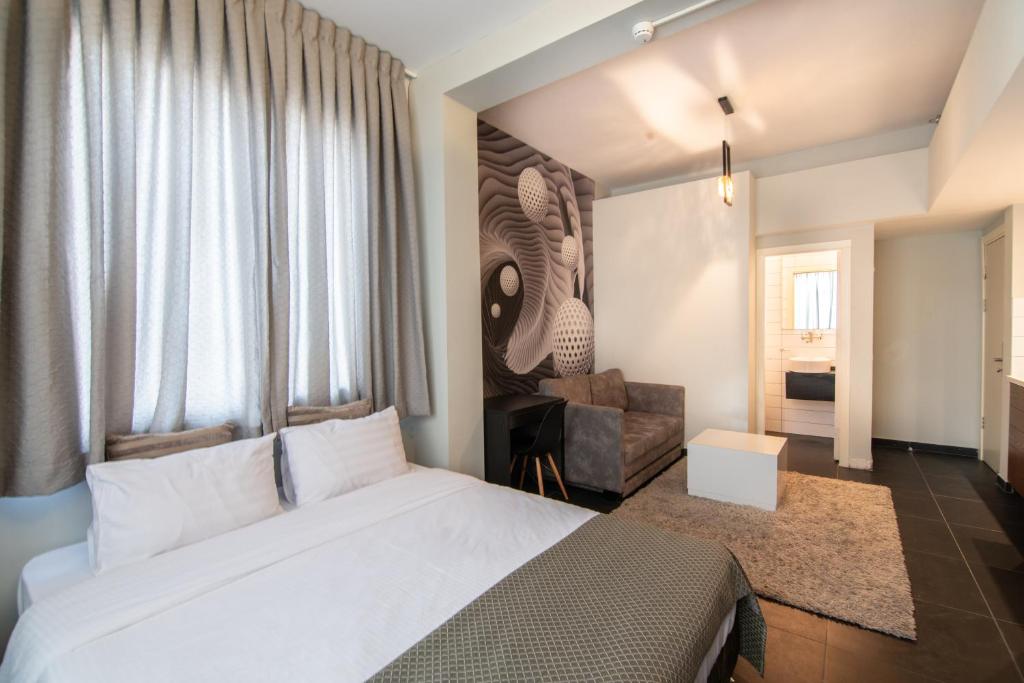 Postel nebo postele na pokoji v ubytování 27Montefiore - Urban ApartHotel TLV
