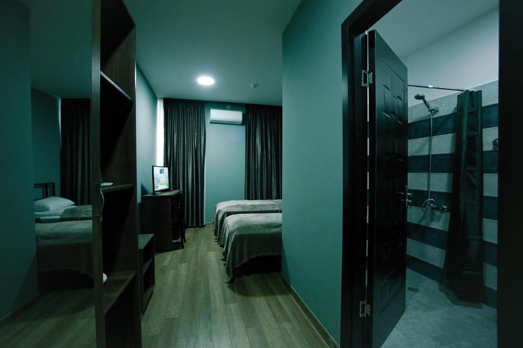 Postel nebo postele na pokoji v ubytování Hotel AGUNA