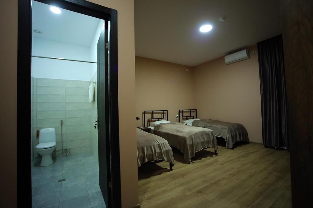 Postel nebo postele na pokoji v ubytování Hotel AGUNA