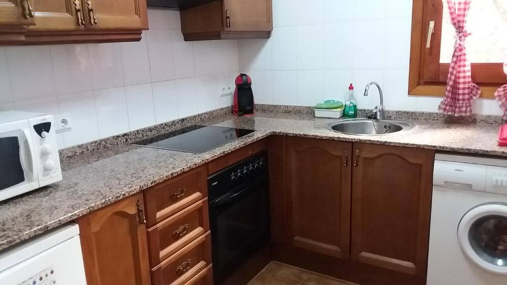 Kuchyň nebo kuchyňský kout v ubytování Apartaments Morello