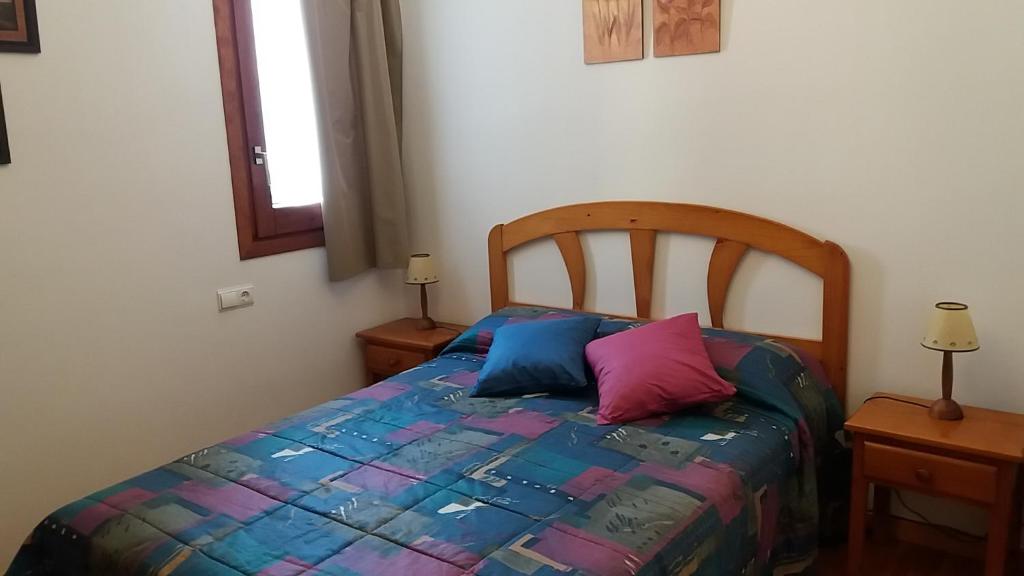 Postel nebo postele na pokoji v ubytování Apartaments Morello