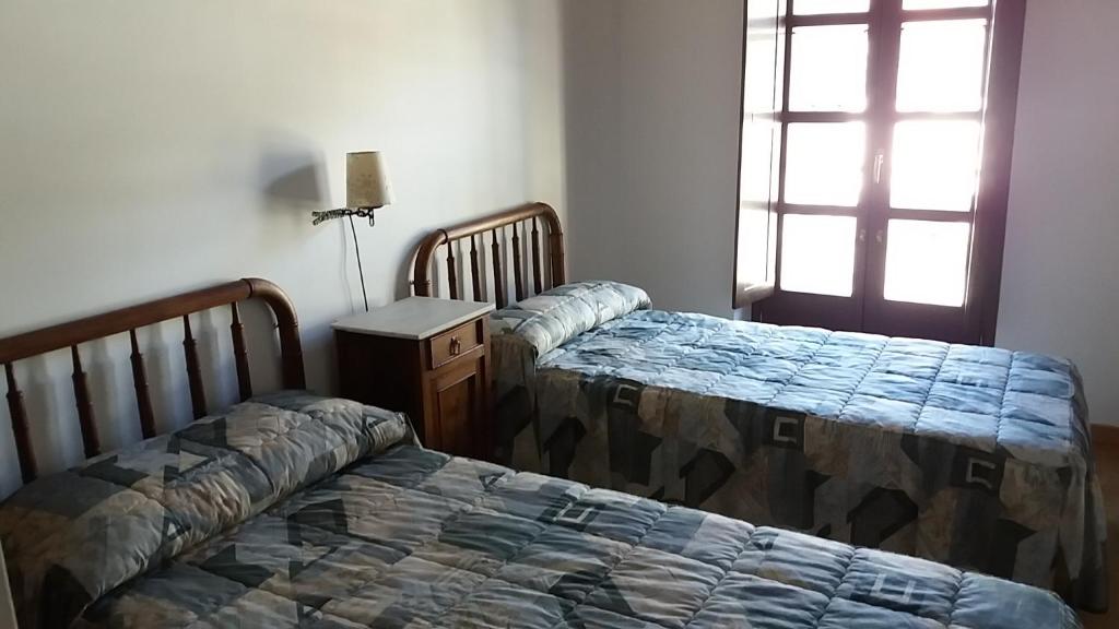 Postel nebo postele na pokoji v ubytování Apartaments Morello