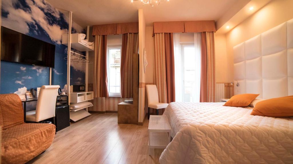 Postel nebo postele na pokoji v ubytování Hotel Jane