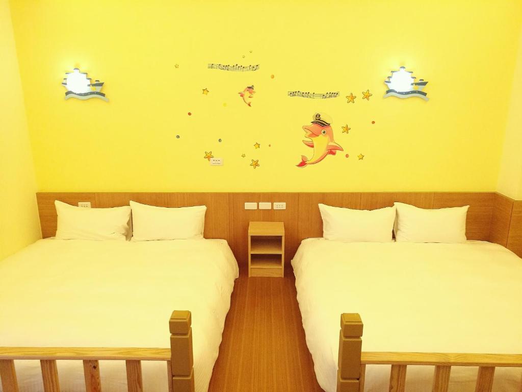 Postel nebo postele na pokoji v ubytování Love Ocean & Happy Bay HomeStay