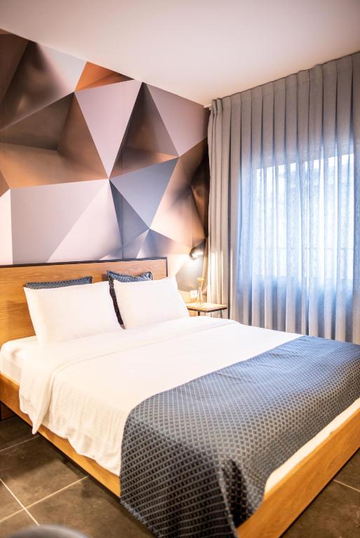 Postel nebo postele na pokoji v ubytování 27Montefiore - Urban ApartHotel TLV