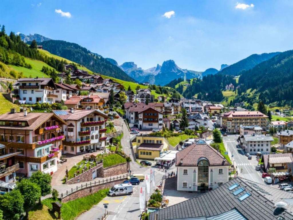 an aerial view of a small town in the mountains at B&B Aretia in Santa Cristina in Val Gardena