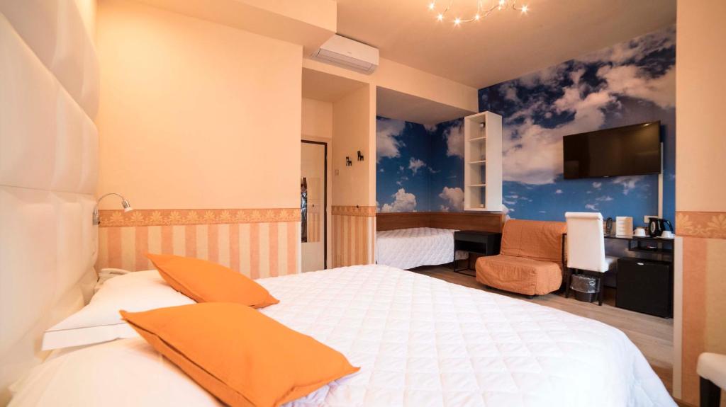 Postel nebo postele na pokoji v ubytování Hotel Jane