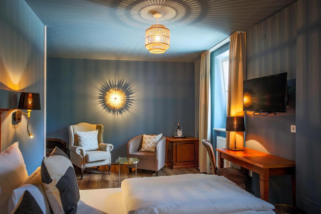 Postel nebo postele na pokoji v ubytování Posthotel Alexander Herrmann