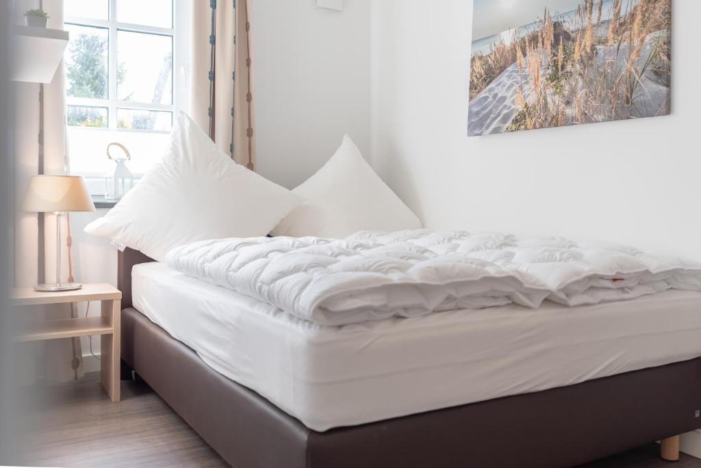 Postel nebo postele na pokoji v ubytování Haus Seegras