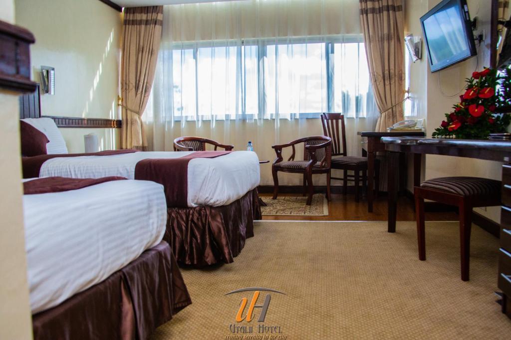 Postel nebo postele na pokoji v ubytování Utalii Hotel