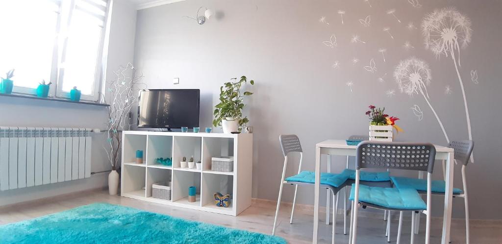 Televízia a/alebo spoločenská miestnosť v ubytovaní GreatHome Apartament