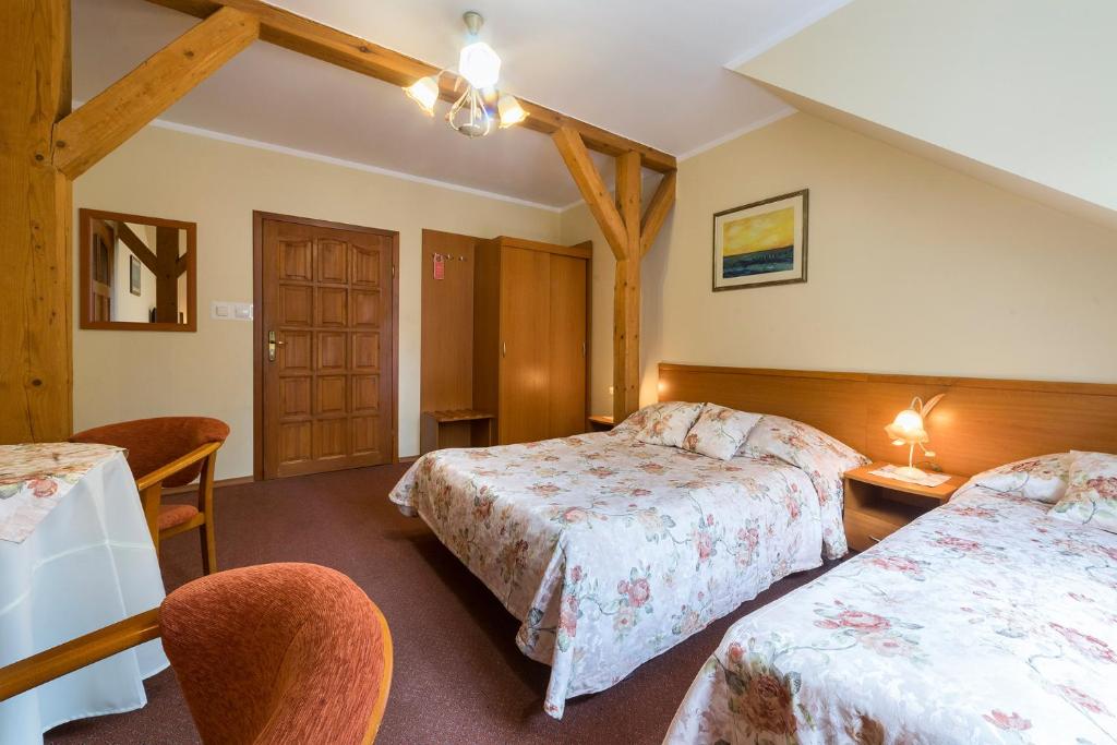 Postel nebo postele na pokoji v ubytování Lech Resort & Spa