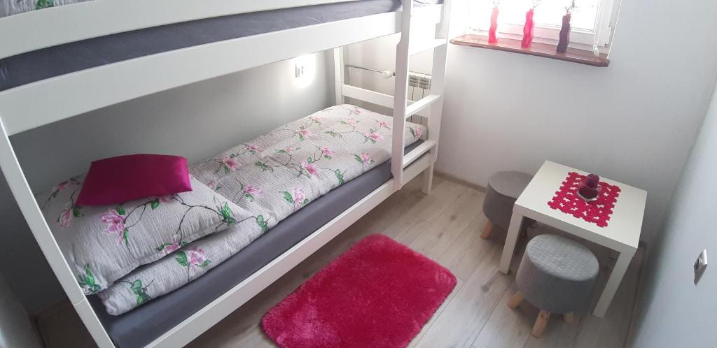 Posteľ alebo postele v izbe v ubytovaní GreatHome Apartament