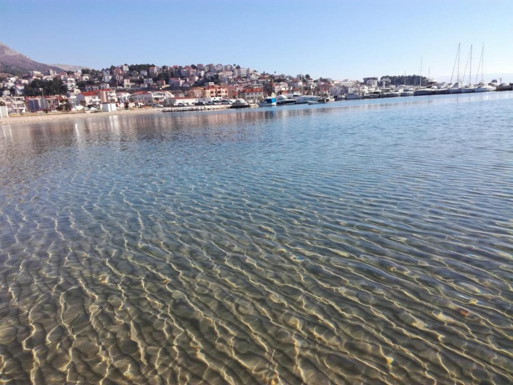 a large body of water with a city in the background at Apartman ''Mathea'' in Podstrana