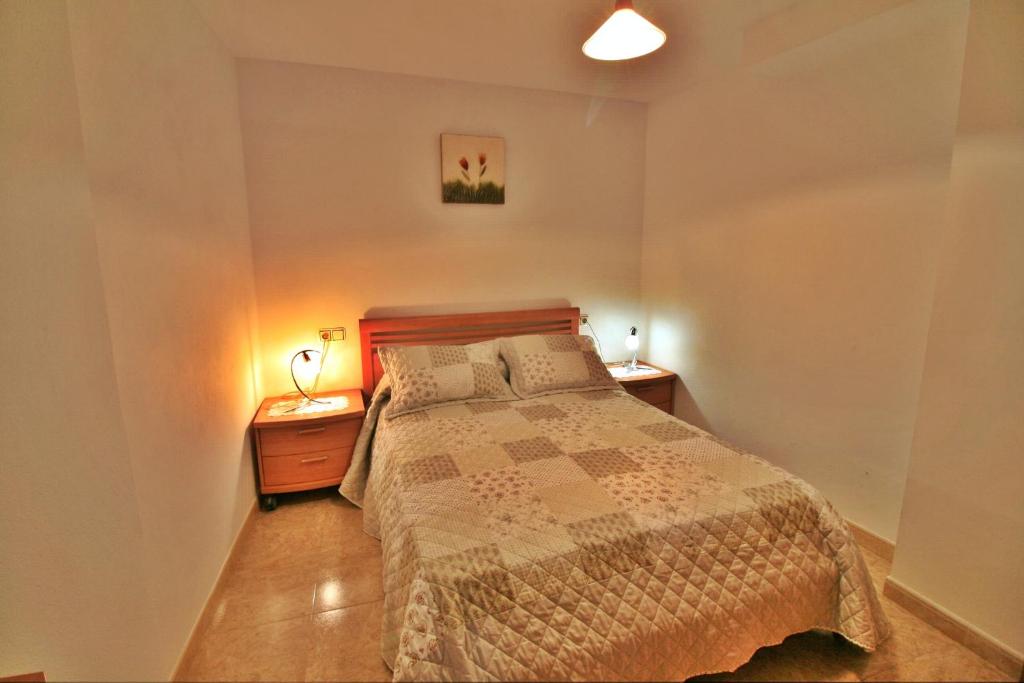 A bed or beds in a room at Apartamento Añon