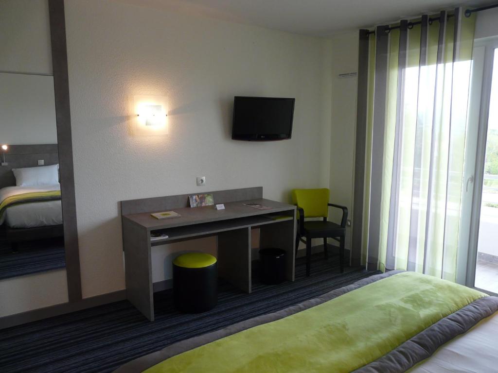 Postel nebo postele na pokoji v ubytování Hotel Le Chatard