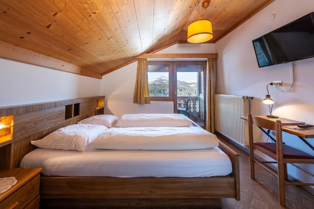 Postel nebo postele na pokoji v ubytování Gasthof Specker