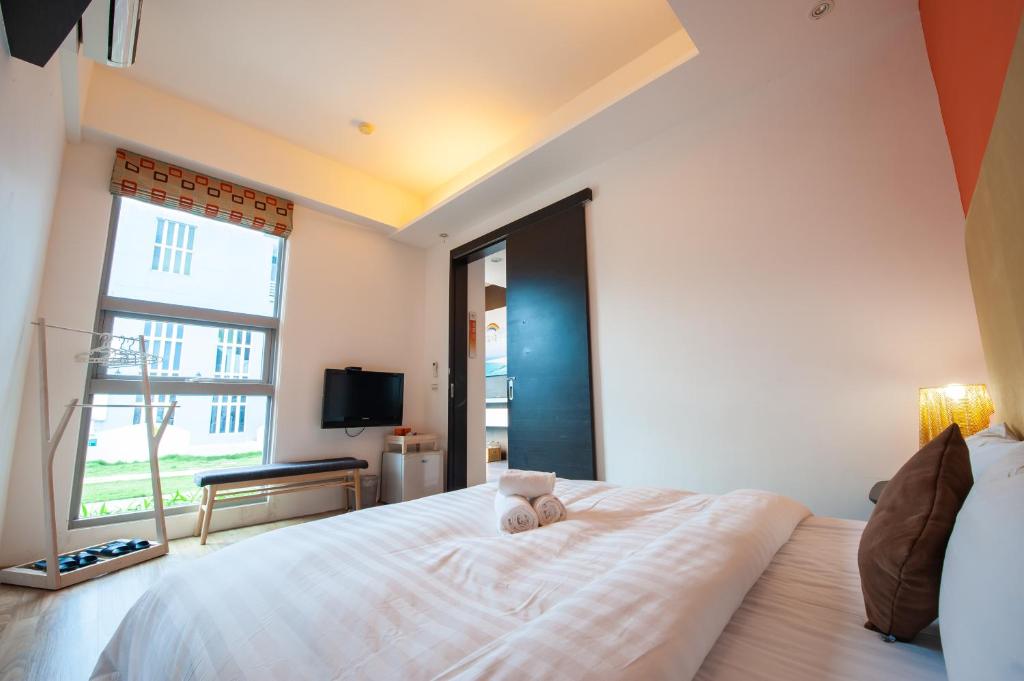 Postel nebo postele na pokoji v ubytování Hai Pu B&B