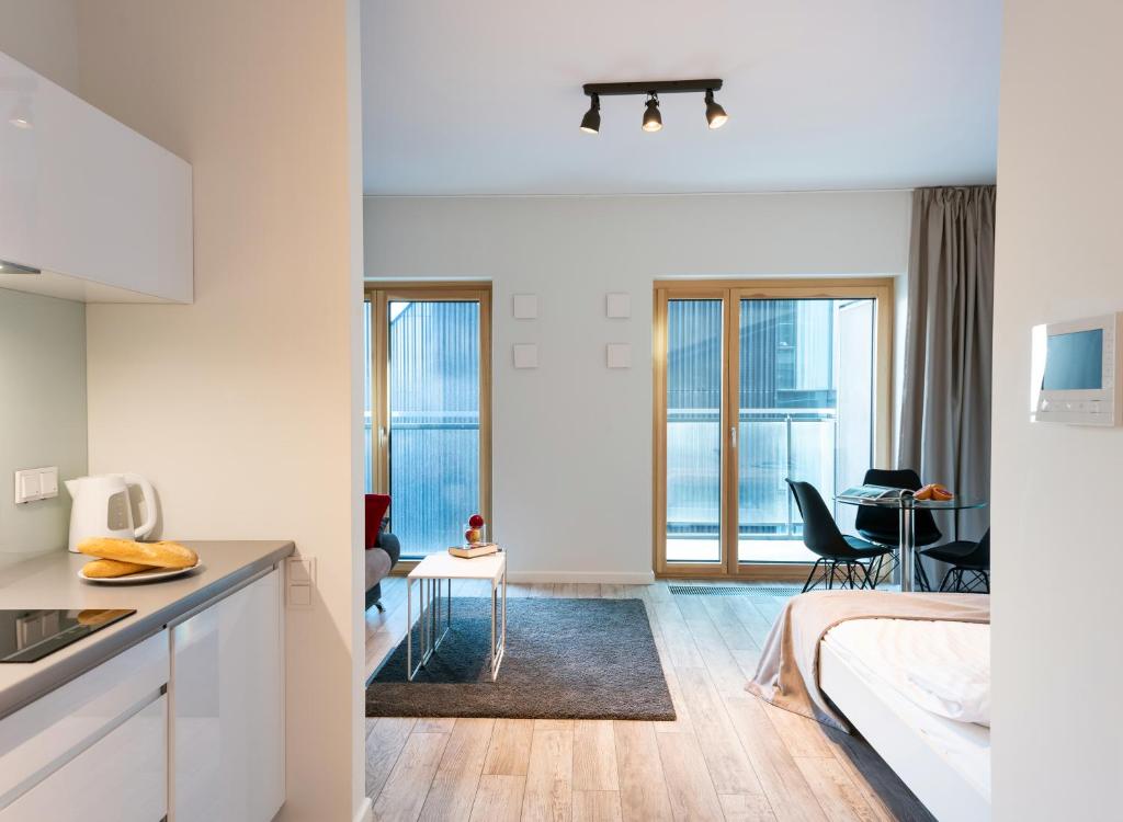 Posteľ alebo postele v izbe v ubytovaní Mennica Central Apartments
