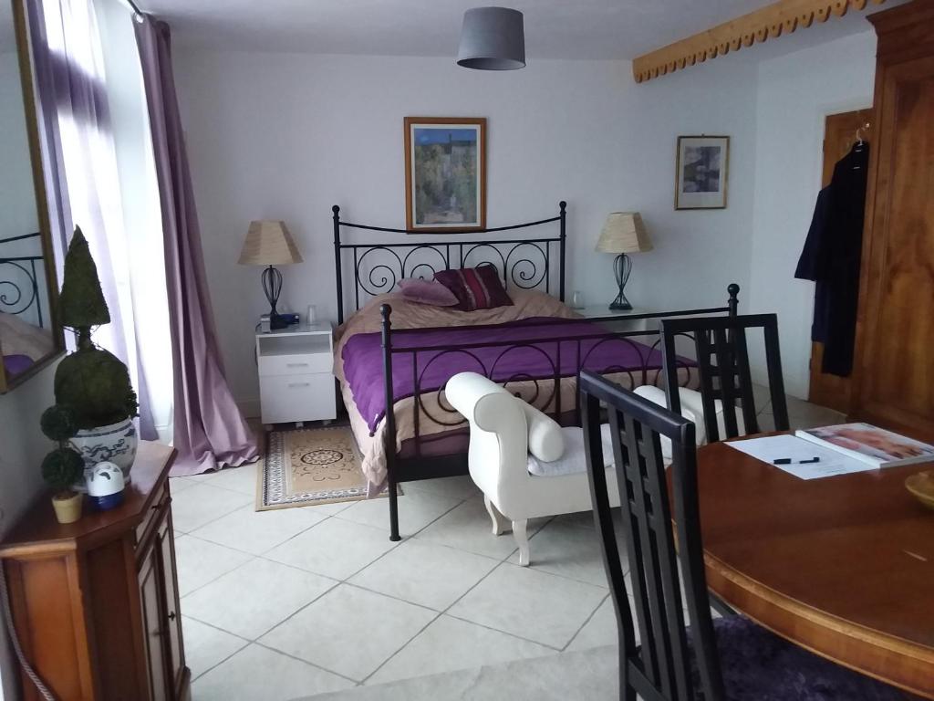 Postel nebo postele na pokoji v ubytování Le Patronage