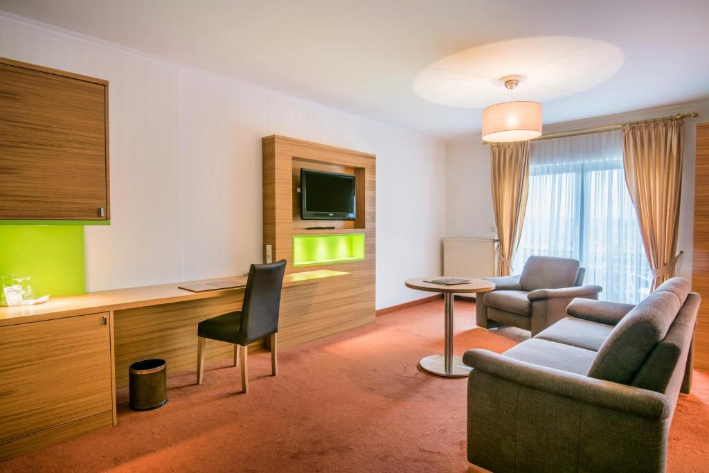 TV a/nebo společenská místnost v ubytování Eden au Lac
