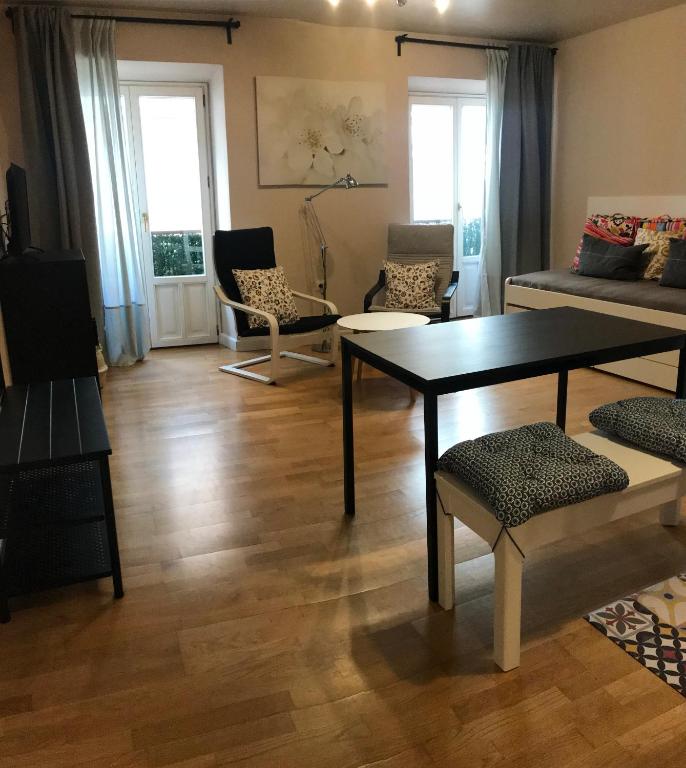 a living room with a table and chairs at Apartamento Sebreñu 1 in Ribadesella