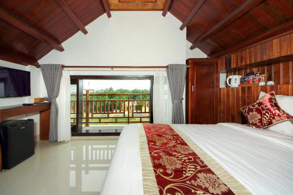 Postel nebo postele na pokoji v ubytování Threeway Riverside Villa