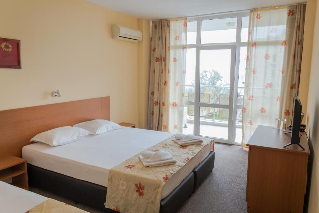 Postel nebo postele na pokoji v ubytování Hotel Eva