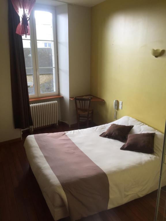Postel nebo postele na pokoji v ubytování Au Père Tranquille