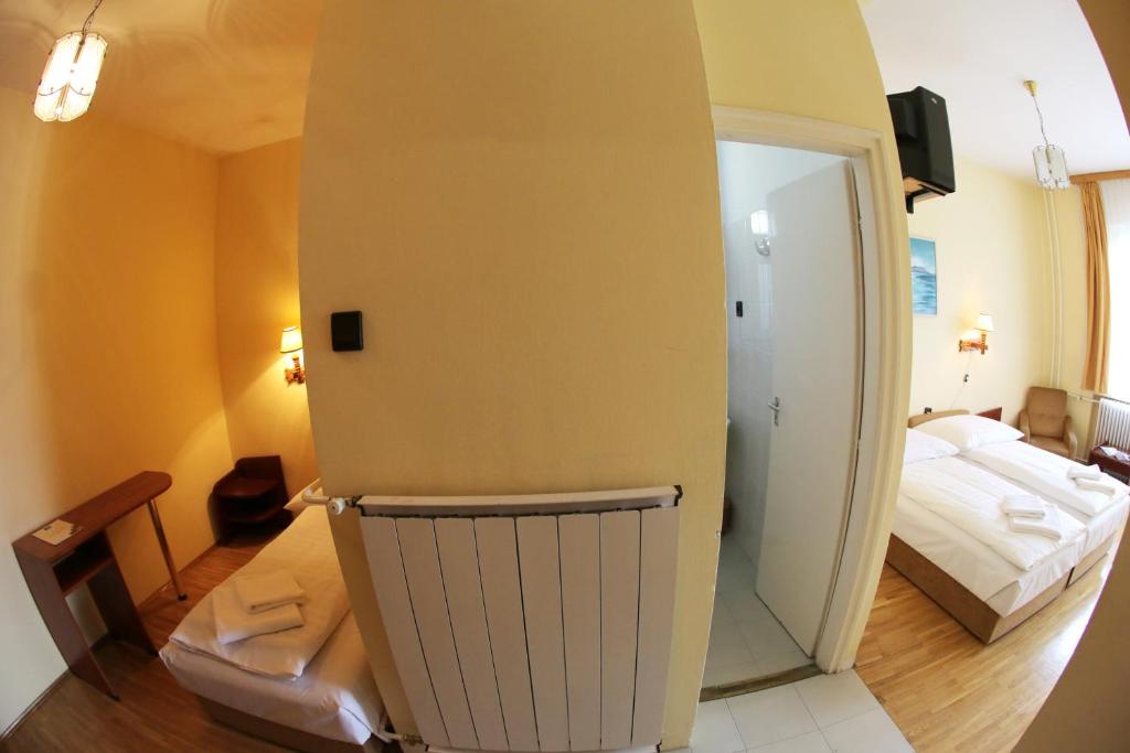 Postel nebo postele na pokoji v ubytování Hotel Bara Junior