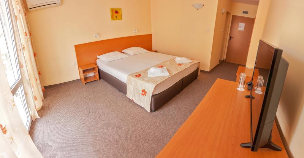 Postel nebo postele na pokoji v ubytování Hotel Eva
